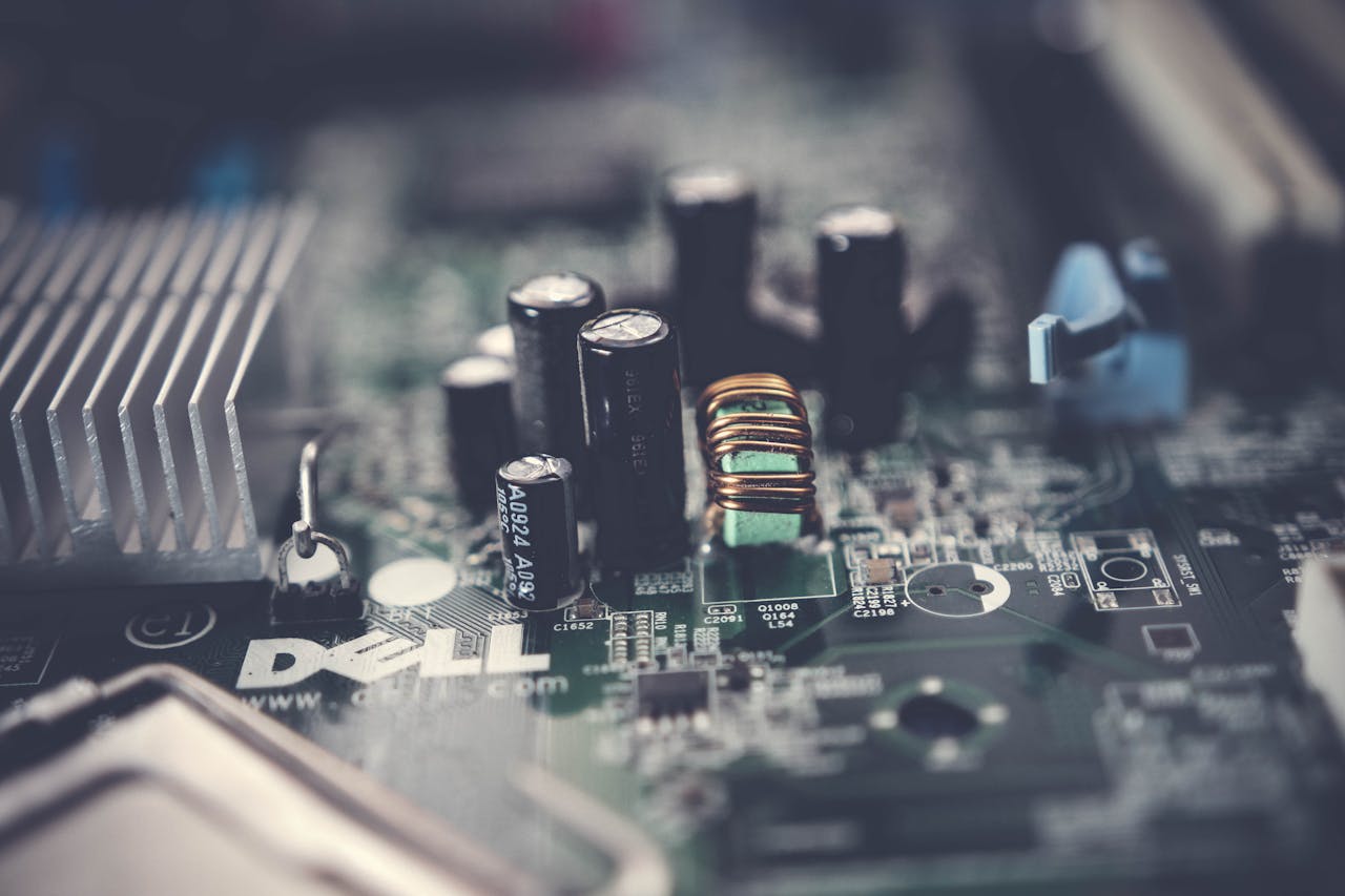 Detailed close-up of a motherboard showcasing electronic components and circuits.